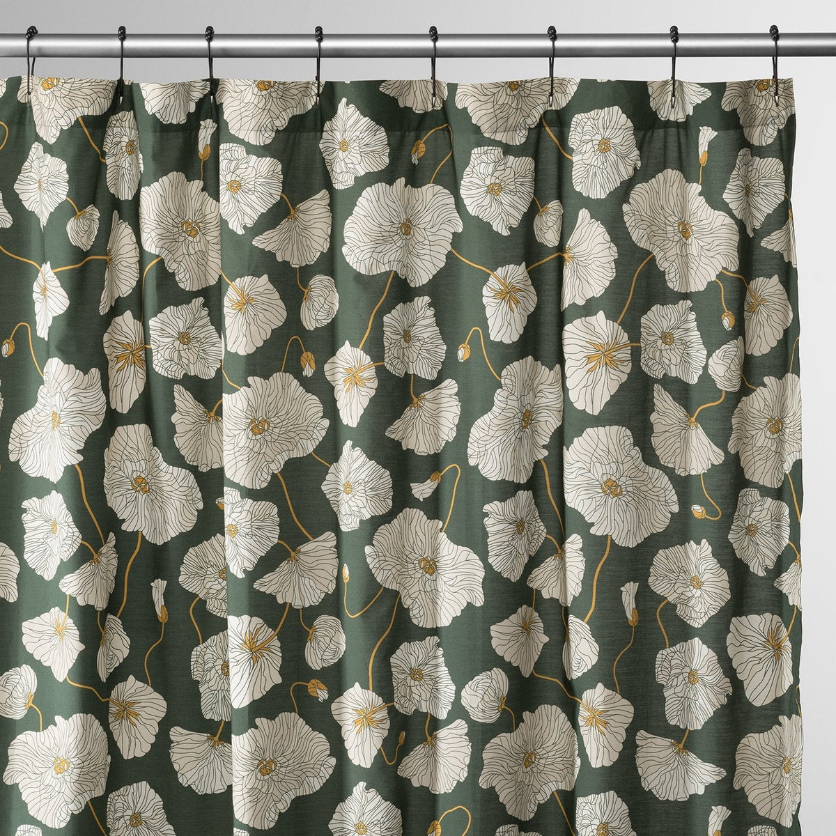 Front view of Blooming Field shower curtain with white poppy pattern and gold stems on green, on silver rod