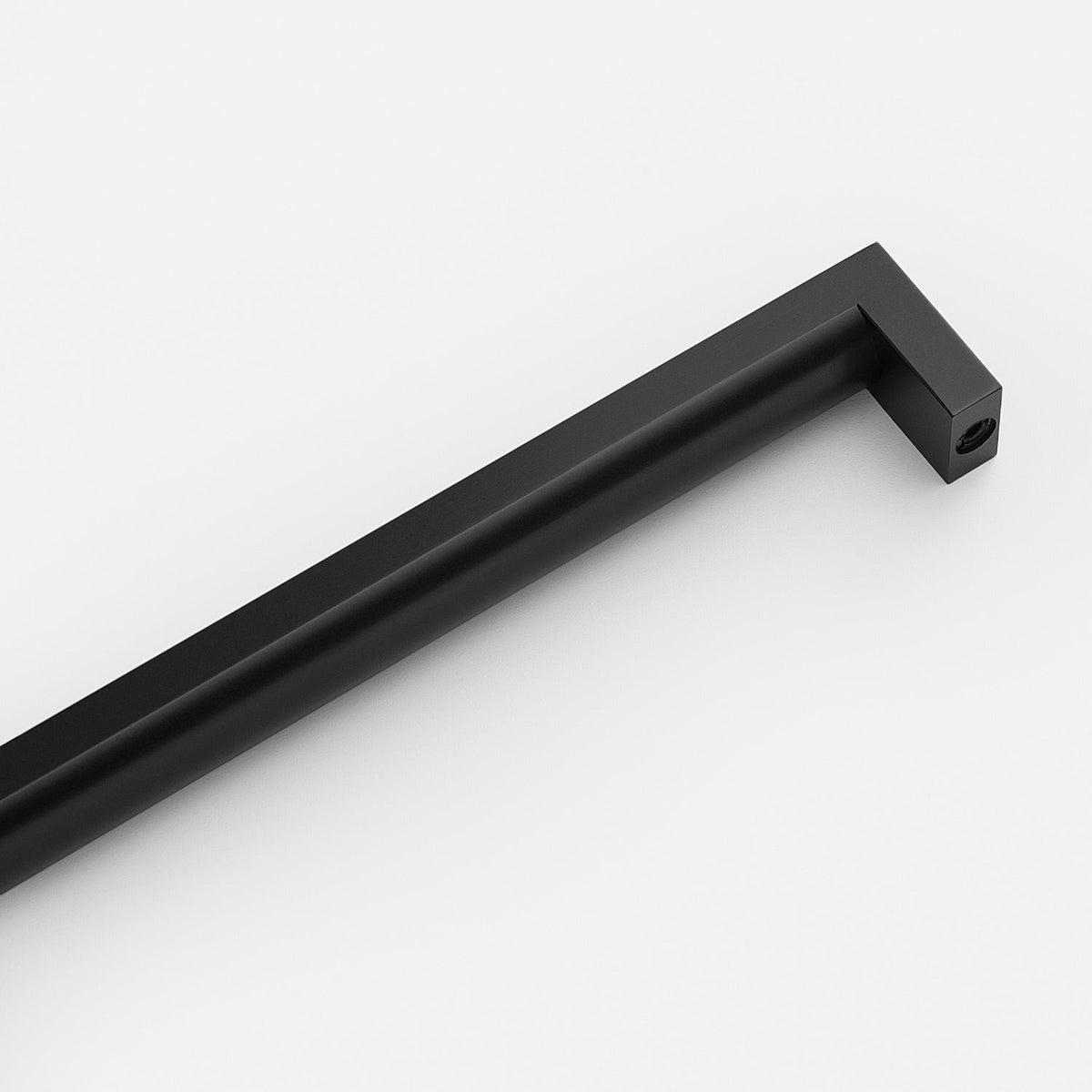 Diagonal view of Edgecliff appliance pull showcasing a black tubular handle and squared ends on a white background