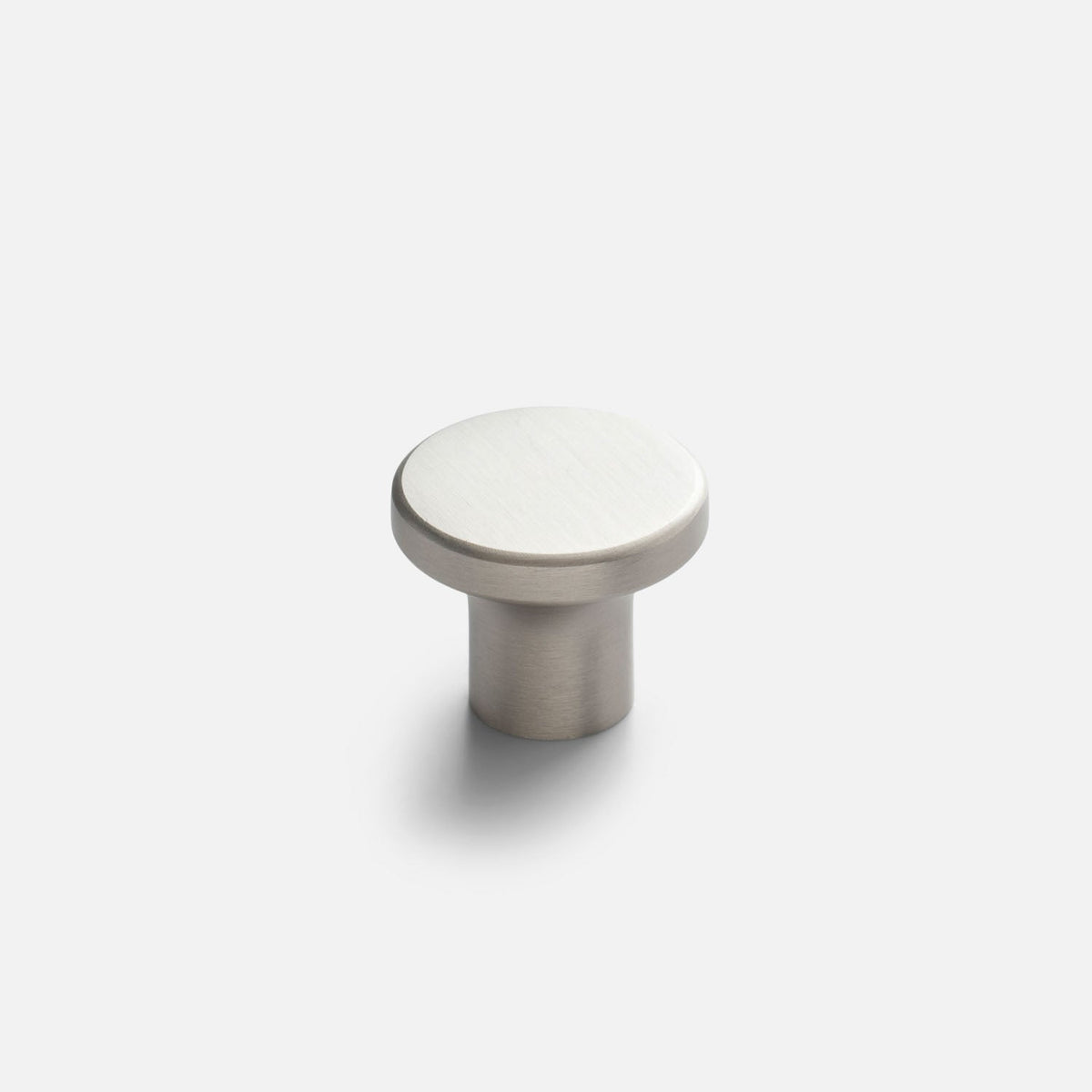 Close-up front view of the Roland Cabinet Knob showcasing its round satin nickel finish and cylindrical base on a white background
