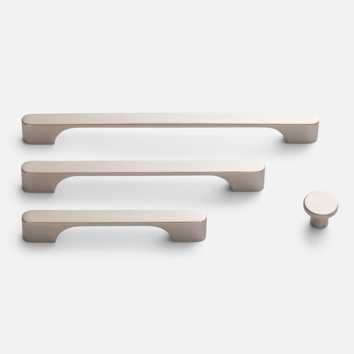 Front view of Roland Pull hardware showing three bar pulls and one round knob in natural brass on a white background