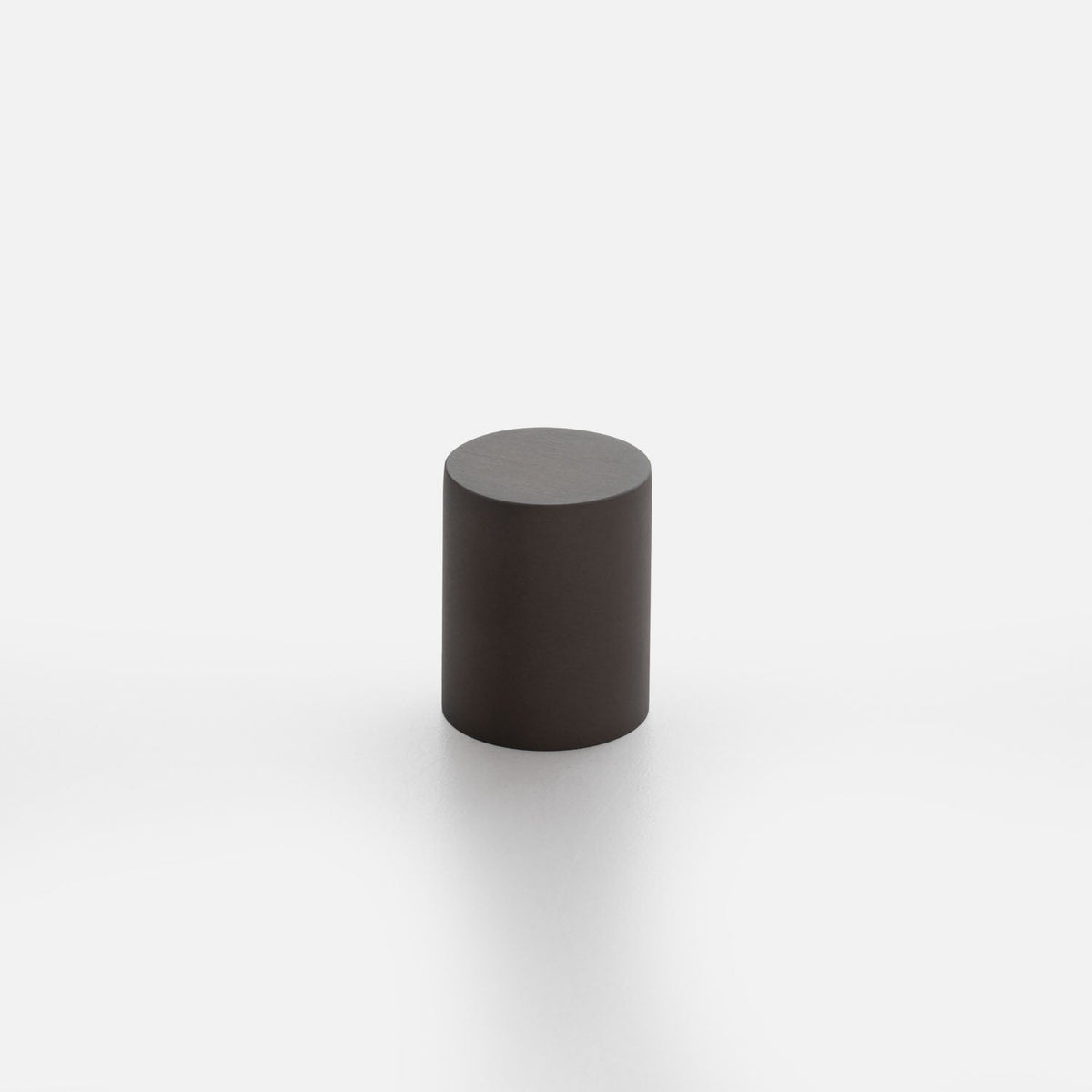 Three-quarter view of Cove knob showcasing its cylindrical shape and flat top with a white background