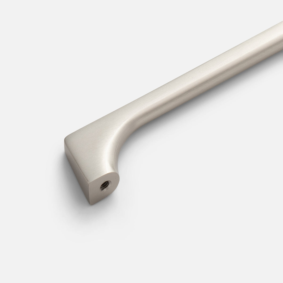 Angled view of Truss Pull showcasing its satin nickel finish and smooth angled design on a white background
