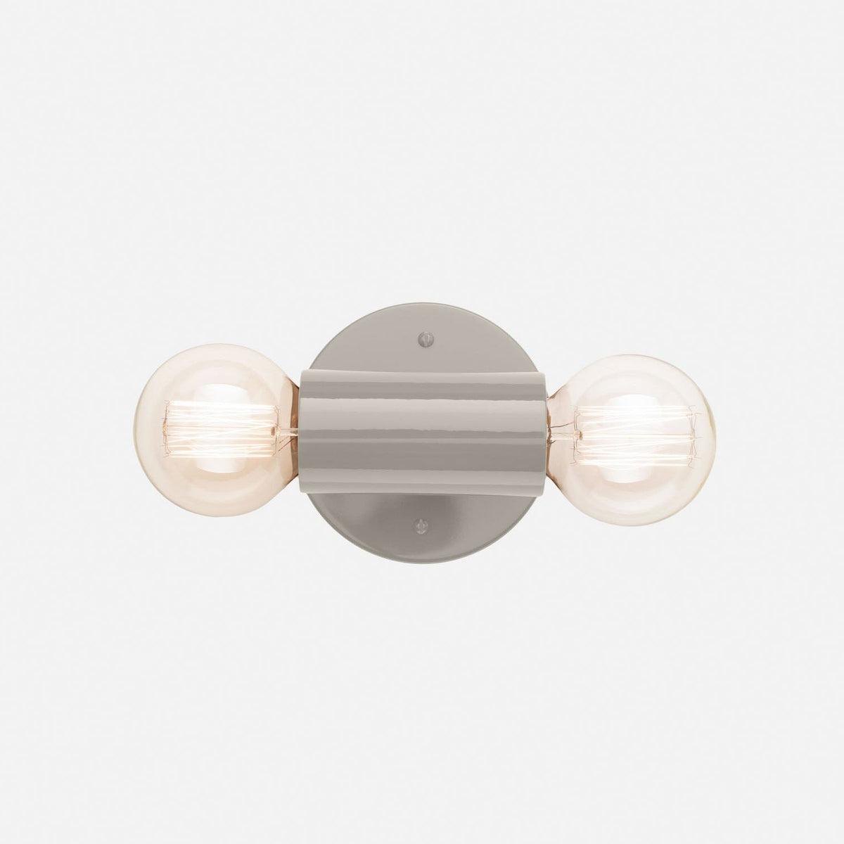 Front view of the Cylinder Double Sconce showcasing its gray gloss finish and two exposed bulbs on a white background