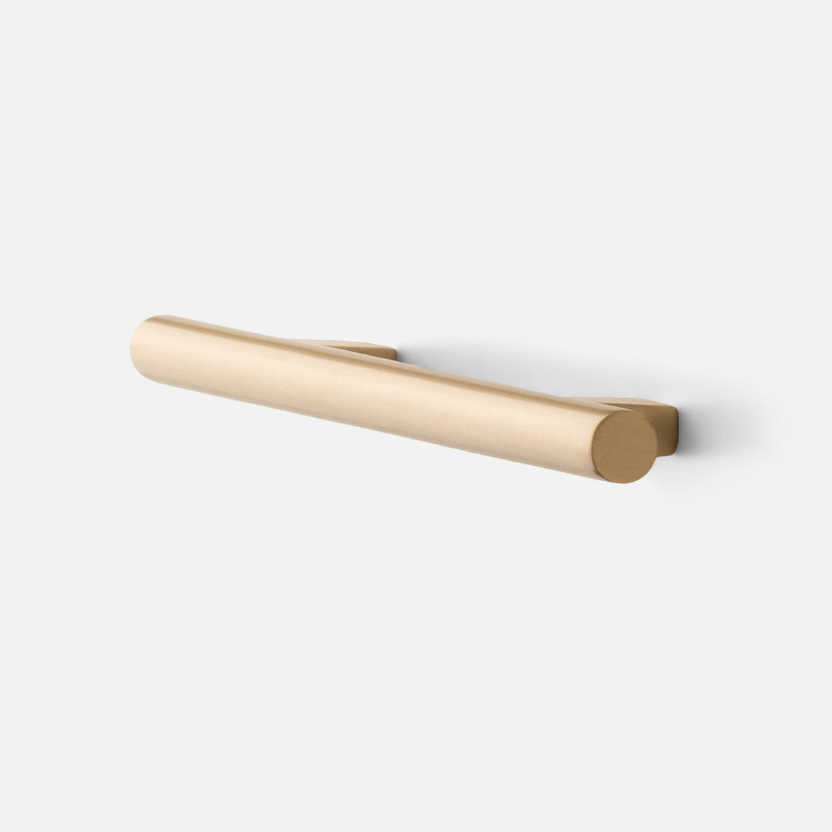 Angled view of Galley Pull showcasing asymmetrical curves and natural brass finish with backplate on white background