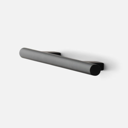 Angled view of Galley Pull showcasing its cylindrical bar and mounting bases in True Black finish on a white background