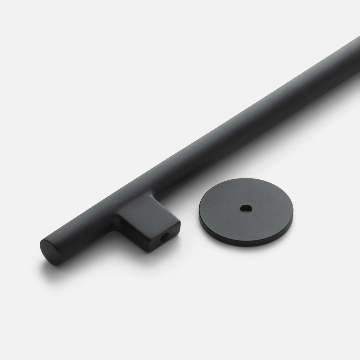 Angled view of Galley Pull showcasing sweeping intersecting curves and round back-plate on a white background