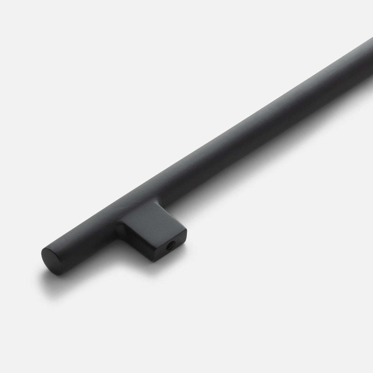 Angled close-up of the Galley Pull showcasing its asymmetrical intersecting curves in a black finish on a white background