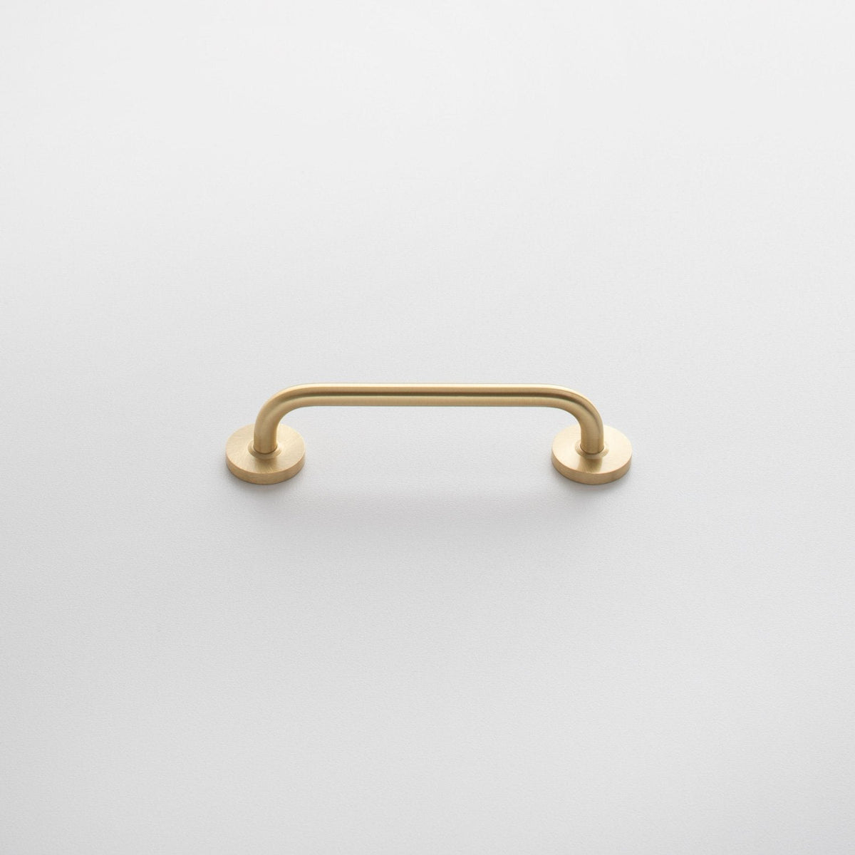 Front view of Parker Pull showcasing its rounded bar and circular mounts on a white background