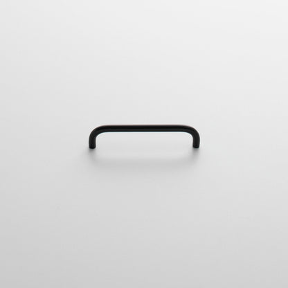 Front view of Parker Pull showcasing its rounded rectangular shape and black finish on a light background
