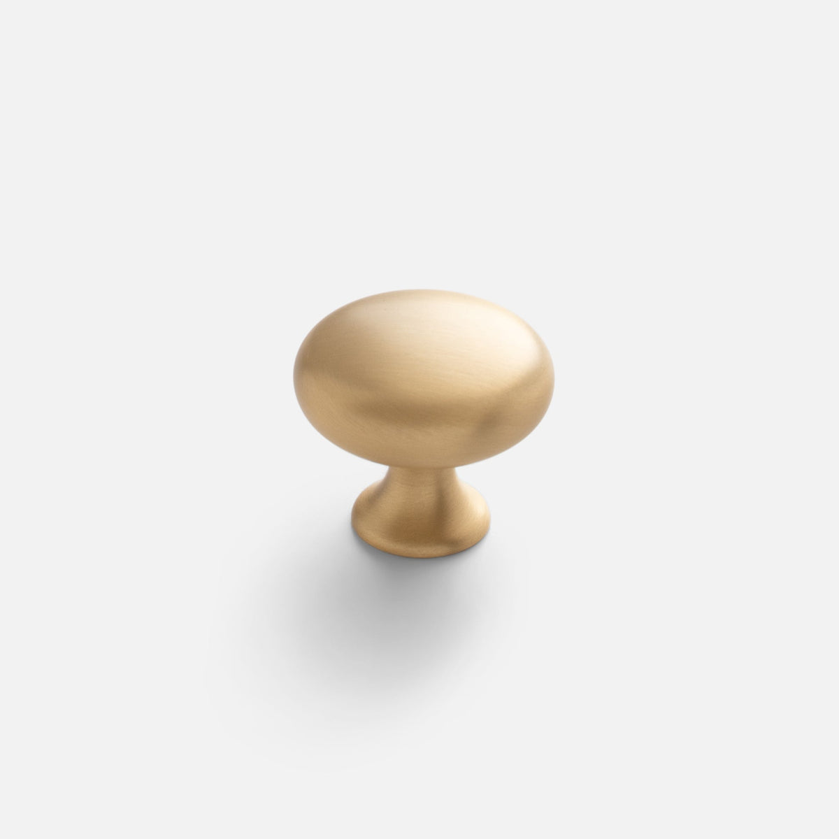 Front view of Somerset Knob showcasing its egg-shaped solid brass silhouette on a white background