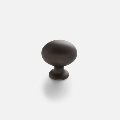 Front view of Somerset Knob showcasing its egg-shaped silhouette in a dark finish against a white background