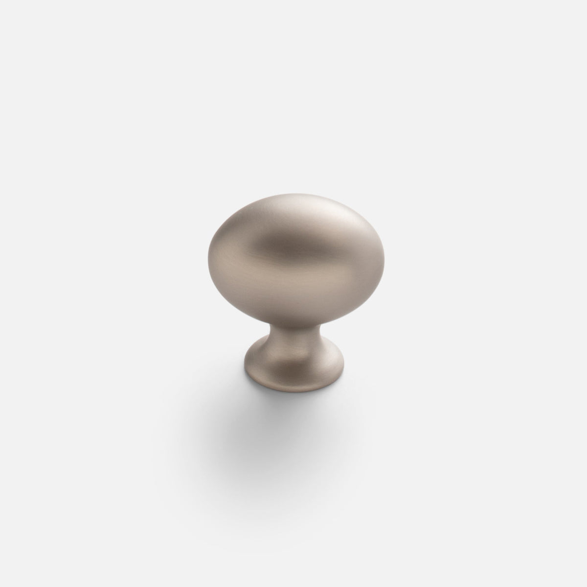 Front view of Somerset Knob showcasing its egg-shaped solid brass silhouette with a light background