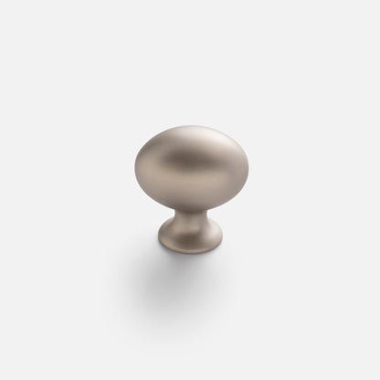 Front view of Somerset Knob showcasing its egg-shaped solid brass silhouette with a light background