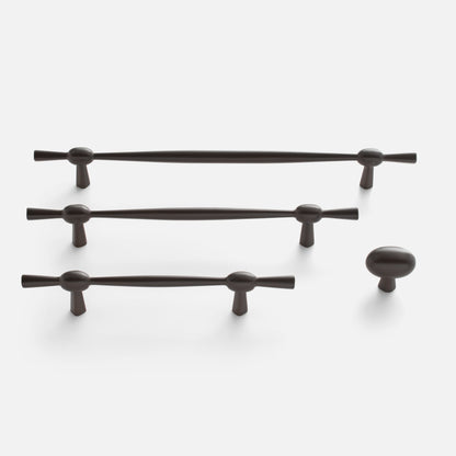 Front view of Eleanor Pull showcasing curved bow tie design in a dark finish on a white background