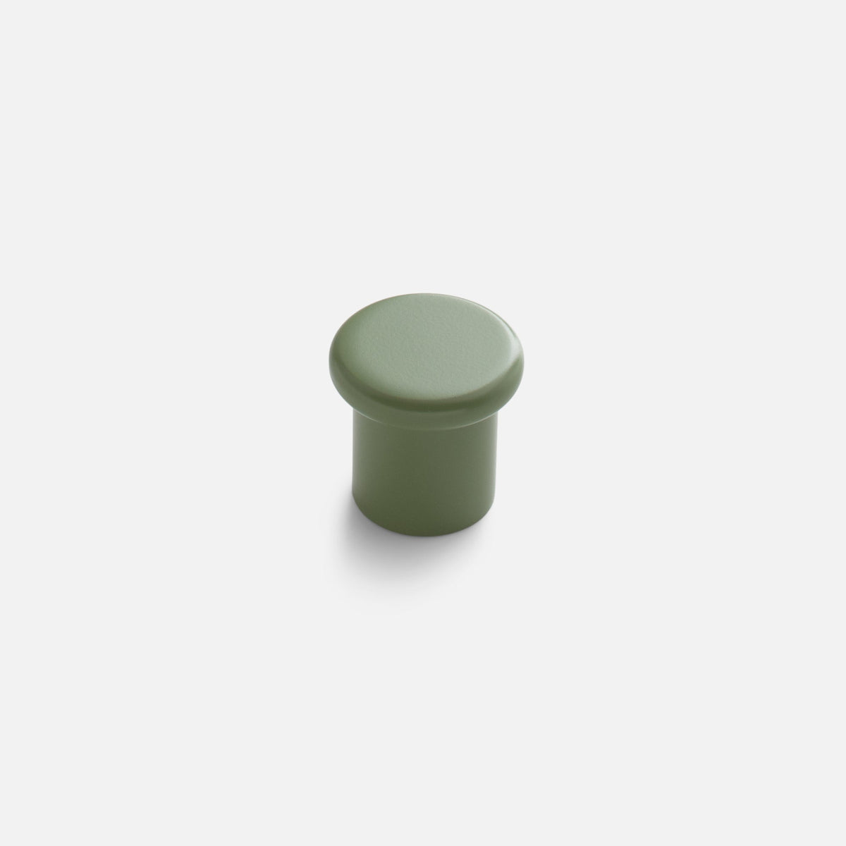 Front view of green Remy Knob showcasing its soft curves and pared-down silhouette with a white background