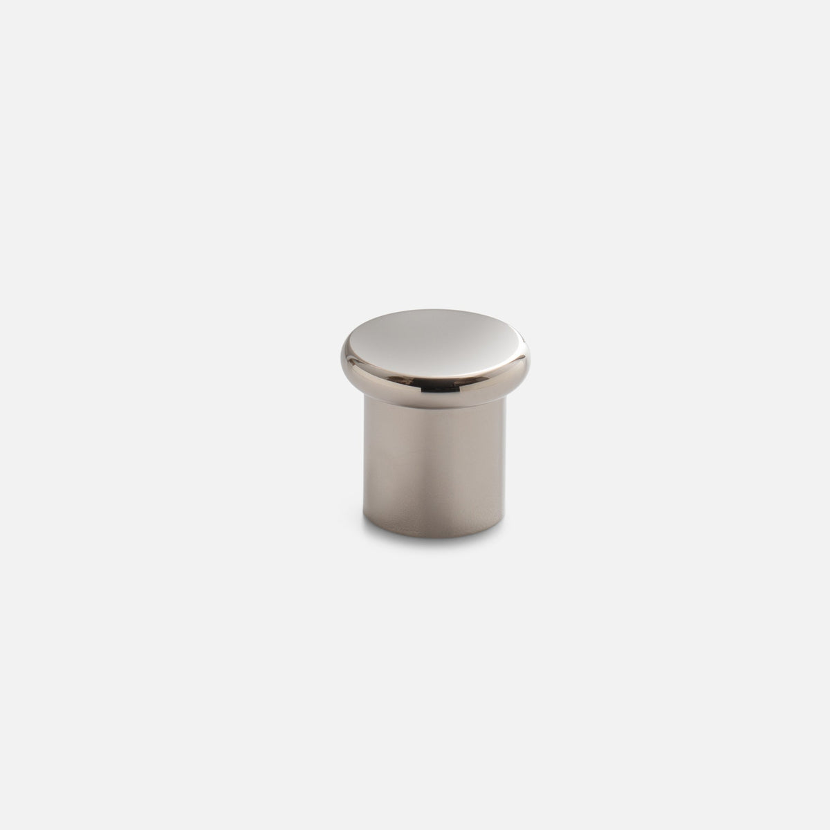 Front view of Remy Knob showcasing its rounded solid brass body and polished top against a light background
