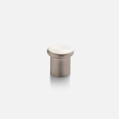 Front view of Remy Knob showcasing a rounded solid brass design with a brushed finish on a light gray background
