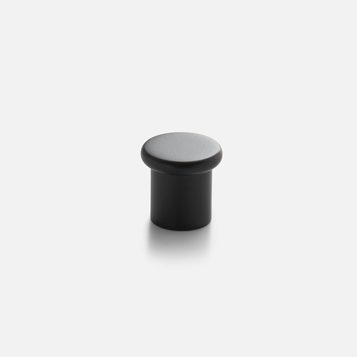 Front view of Remy Knob showcasing its rounded cap and cylindrical shape on a light gray background