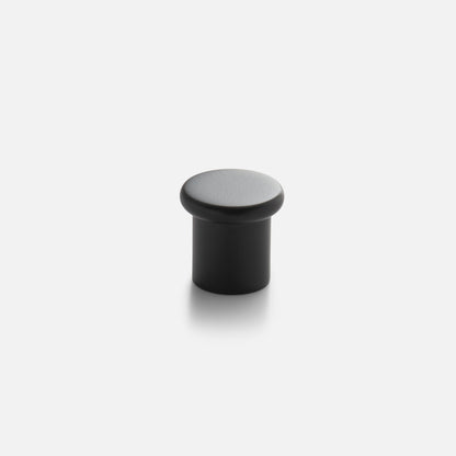 Front view of Remy Knob showcasing its rounded cap and cylindrical shape on a light gray background