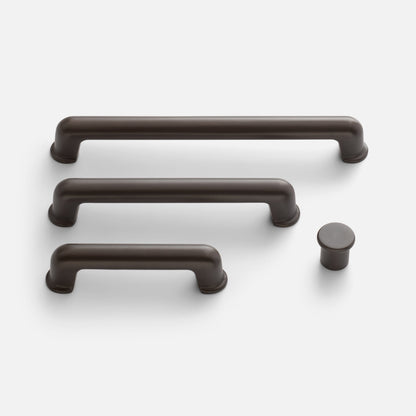 Front view of Remy Pull cabinet hardware showcasing rounded bar pulls and a coordinating knob on a white background