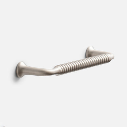 Angled view of Whittaker Pull showcasing ribbed solid brass design in satin nickel finish against a light gray background