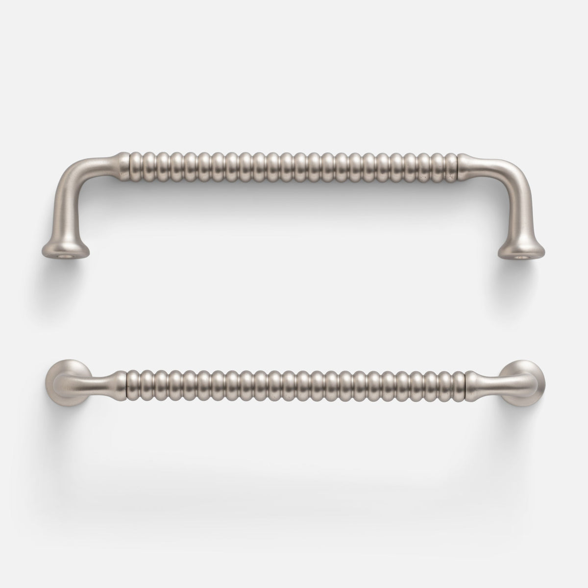 Two views of the Whittaker Pull showcasing its ribbed solid brass handle in satin nickel on a white background