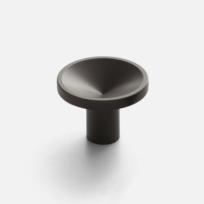 Close-up view of Rhone Cast Brass Knob showcasing its rounded textured top and cylindrical stem on a light background