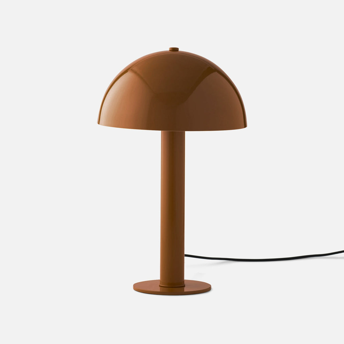 Front view of Sidnie table lamp showcasing its butterscotch gloss mushroom shape and black cord on a white background