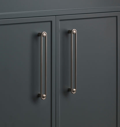 Close-up of the Landon Pull showcasing its elongated rounded design on dark cabinet doors
