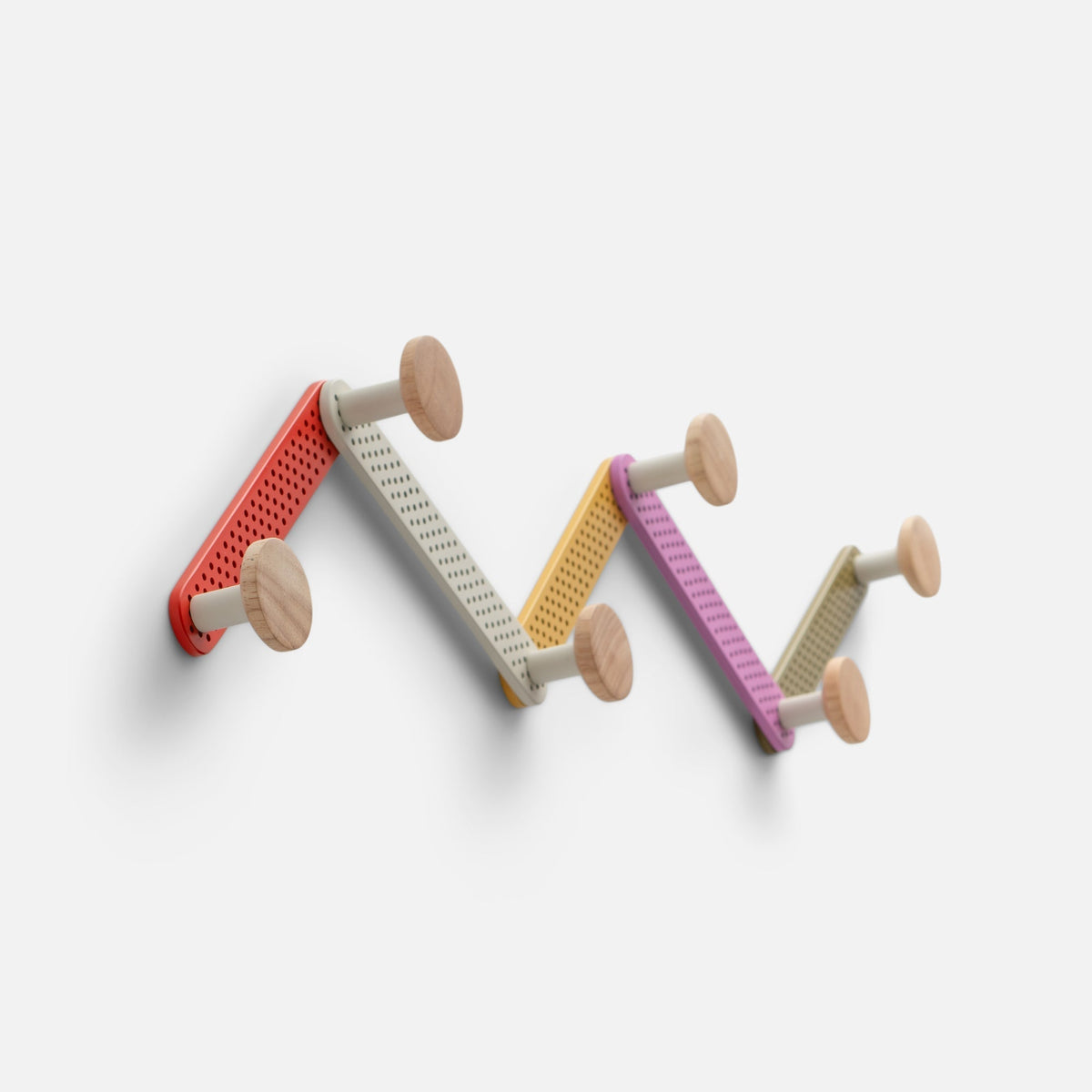 Front view of Tula Hook showcasing perforated multicolor metal and natural wood finials against a white background