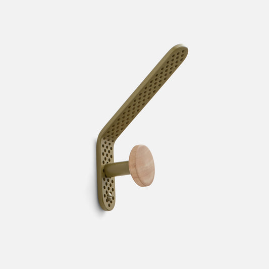 Angled view of Tula Hook showcasing Olive Satin perforated aluminum and natural wood finial on a white background
