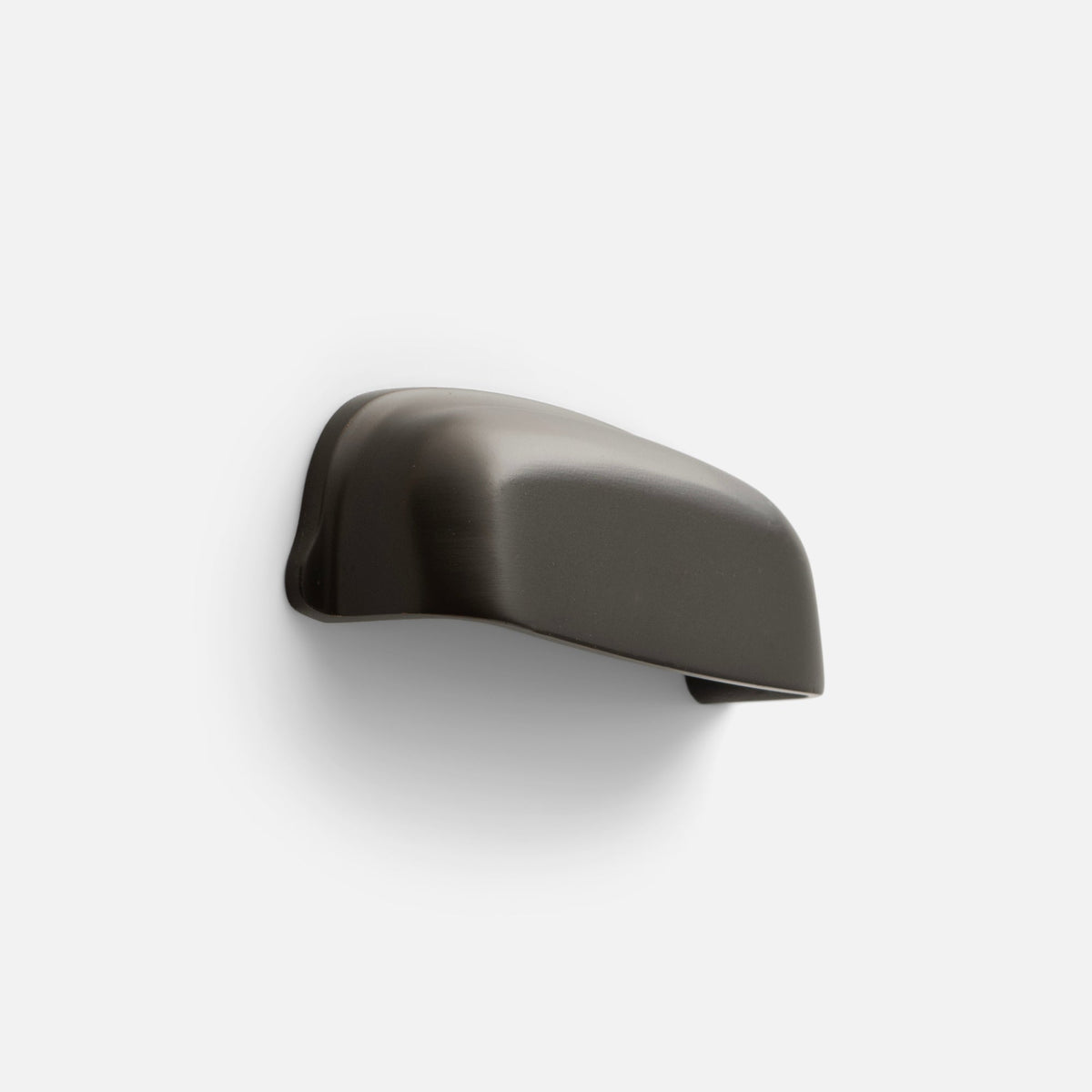 Side view of Darby Cup Pull showcasing its gently curved Oil Rubbed Bronze silhouette on a white background
