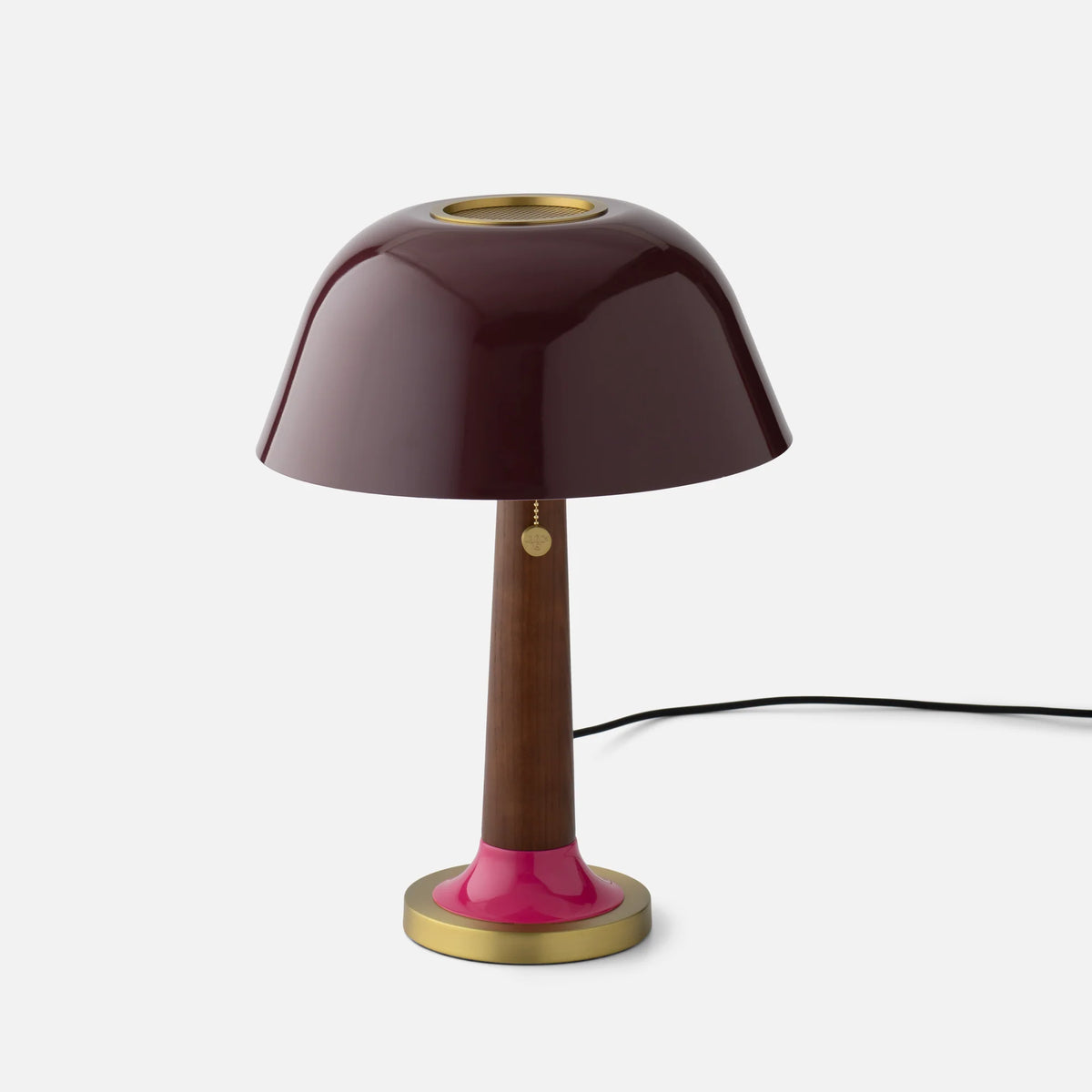 Front view of Evelyn Table Lamp with dark gloss mushroom shade, perforated brass diffuser, and brass base