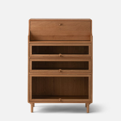 Front view of Peggy Cabinet showcasing four wood-front drawers and tapered legs against a white background