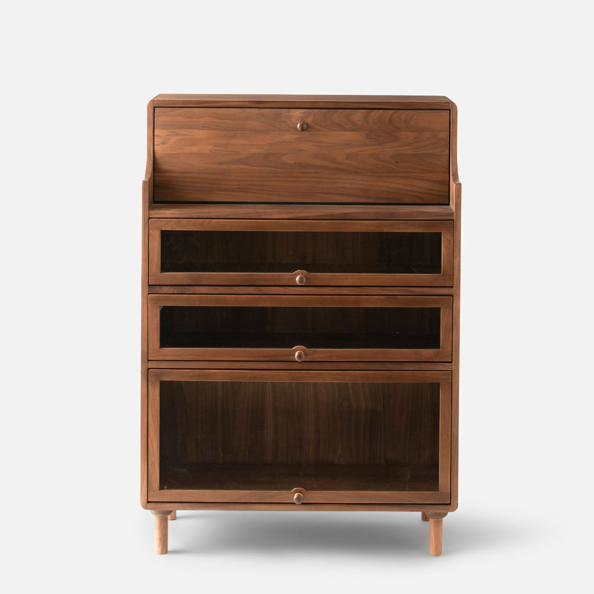 Front view of Peggy Cabinet showcasing four stacked storage compartments, round knobs, and tapered legs against a white background