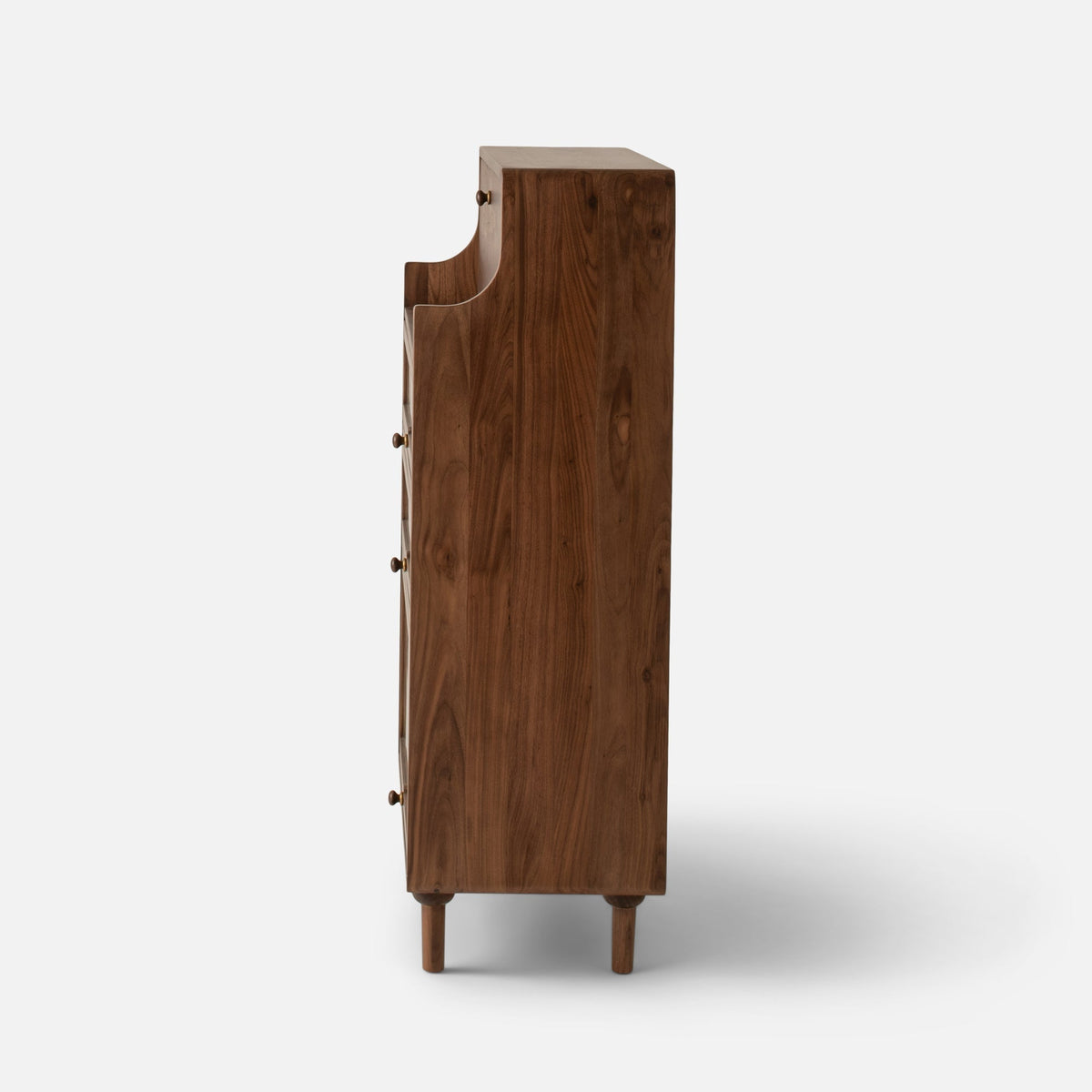 Side view of Peggy Cabinet showcasing dark wood grain, rounded legs, and brass knobs against a white background