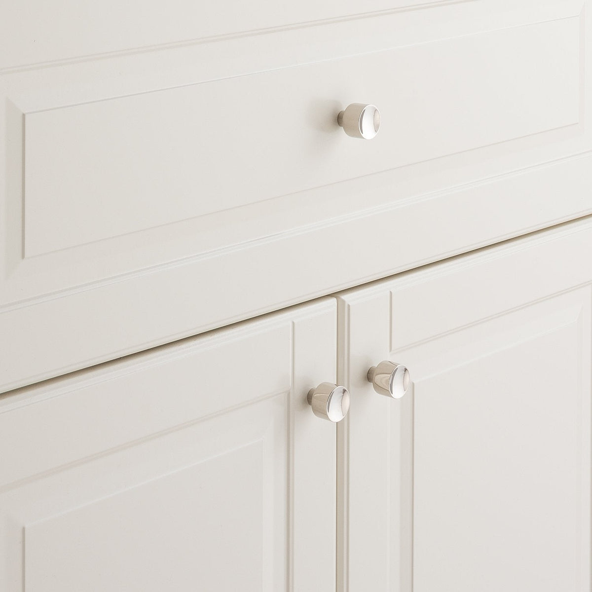 Mid Century Knob installed on white paneled cabinetry