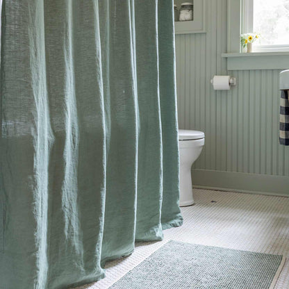 Front view of 100% Linen Shower Curtain in Laurel showcasing lived-in texture in a bright bathroom