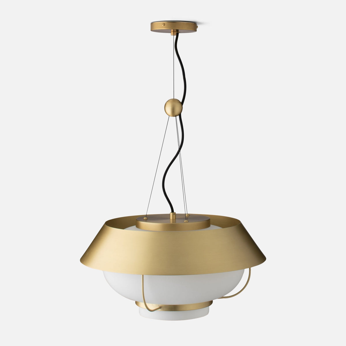 Front close up of Alfred Pendant showing natural brass canopy, twisted black cord, and white opal glass diffuser on light gray background