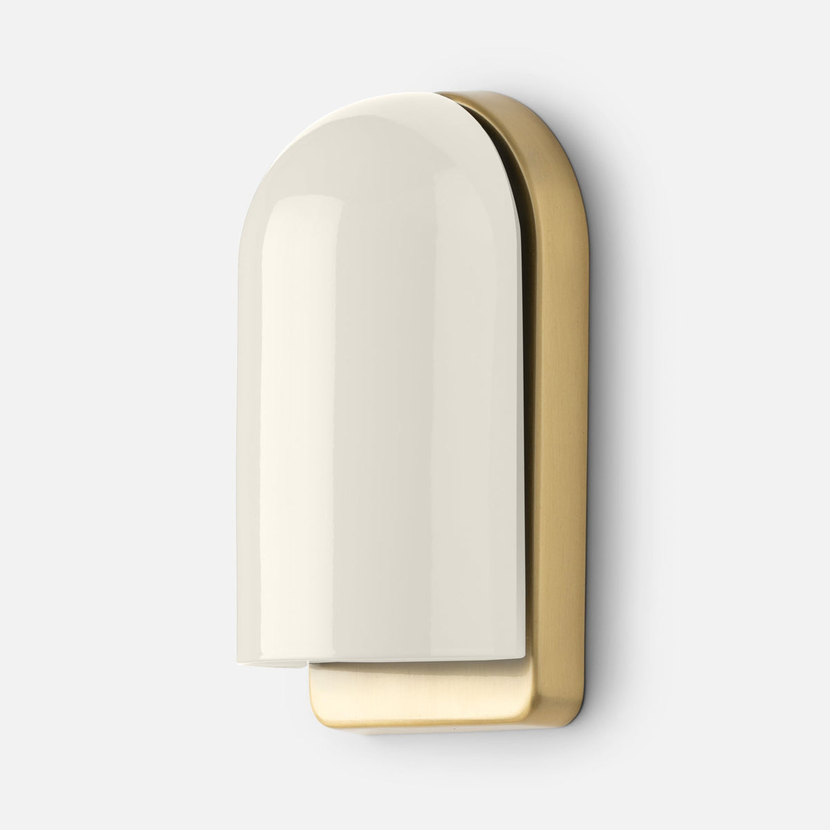 Close-up of Allegheny Slim Sconce showing glossy cream ceramic shade and brushed brass backplate on a light gray background